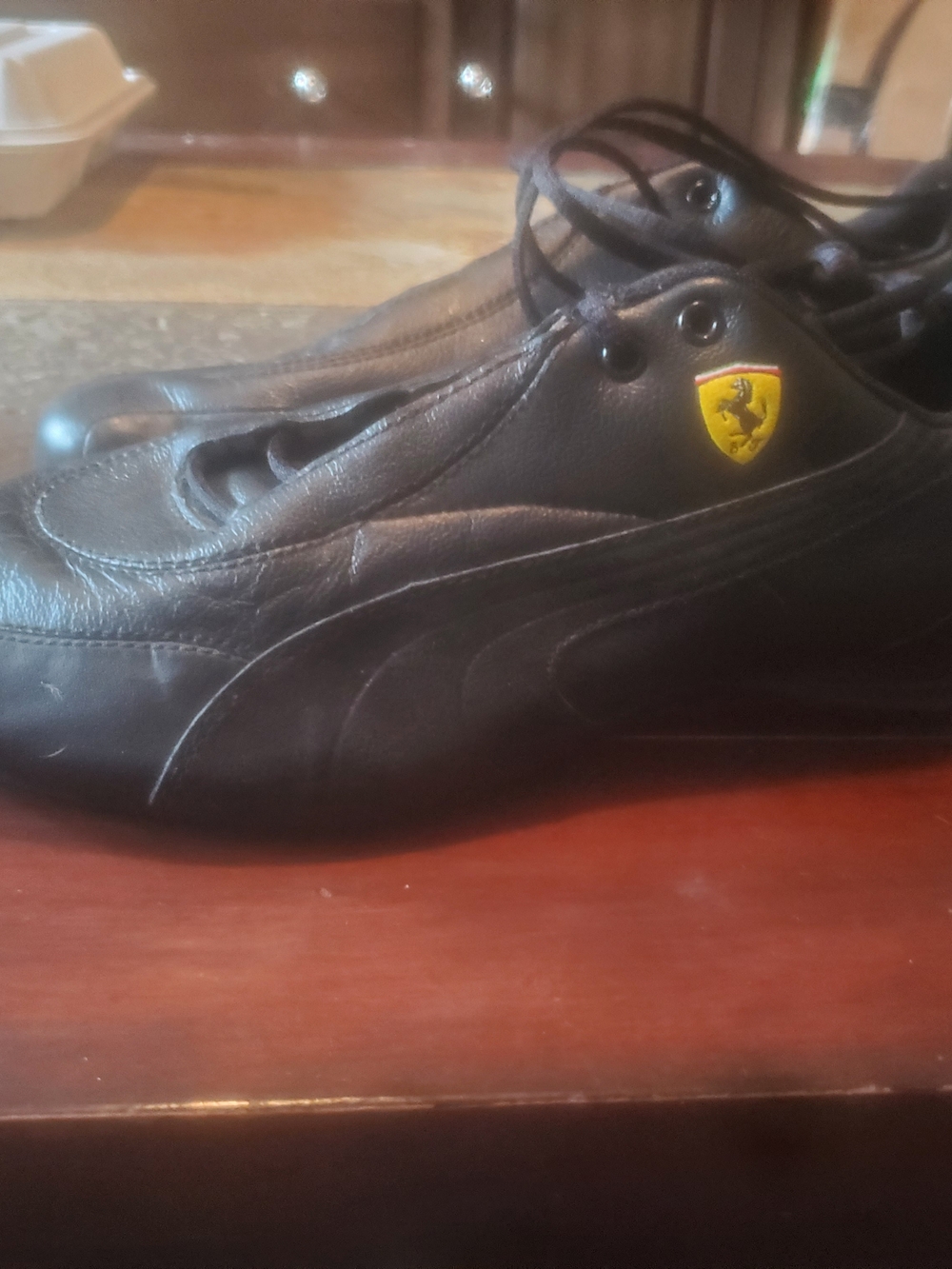 Puma Men’s Black Leather Sneakers with Yellow Shield Accent